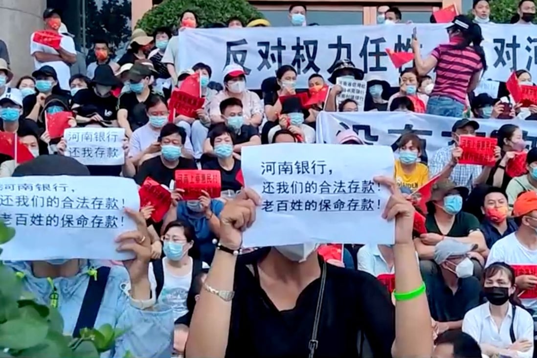 A protest over the freezing of deposits by some rural banks in Henan province in the summer. The scandal was cited as an example of problems at small local banks can spread nationwide. Photo: via Reuters  