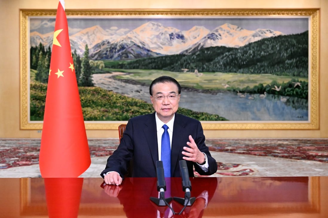 Chinese Premier Li Keqiang addresses business leaders from Japan and China via video link on Monday. Photo: Xinhua