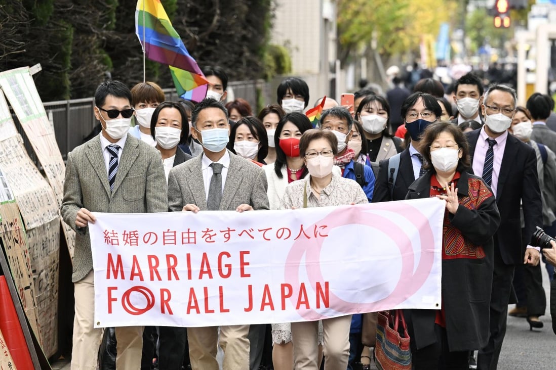 Same-sex plaintiffs and supporters walk to the district court in Tokyo, Japan. Photo: AP