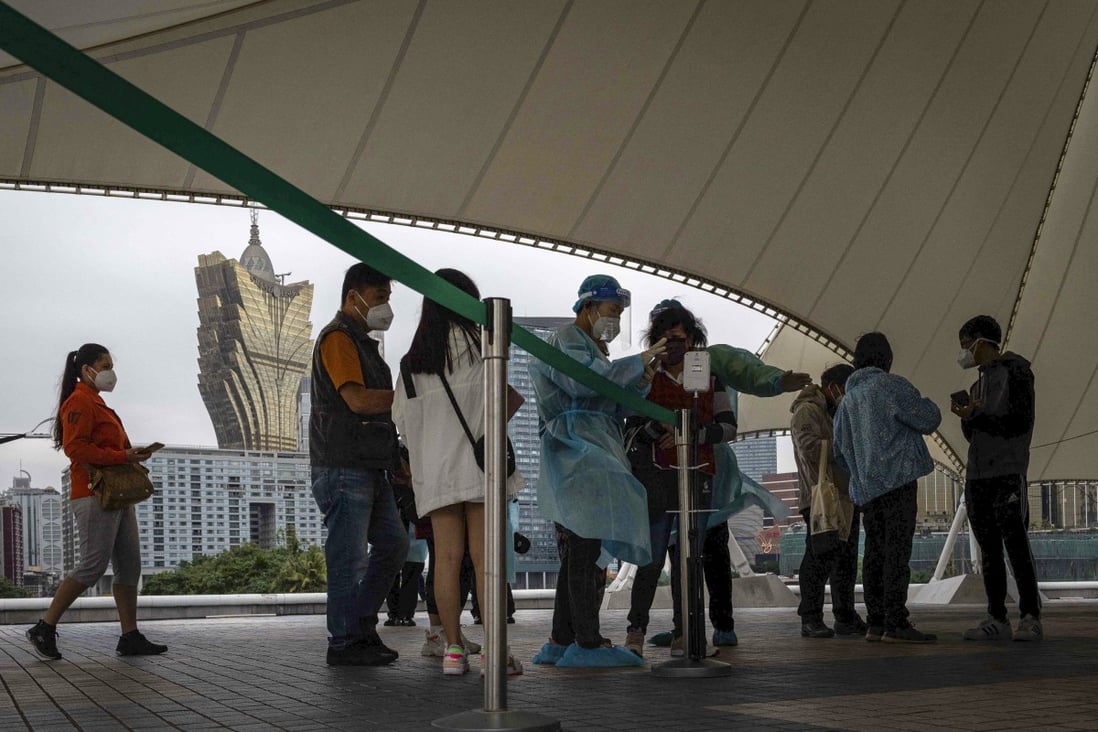Residents wait in line to undergo Covid-19 tests in Macau on November 1, 2022. The city’s gaming industry continues to reel from Covid curbs. Photo: AFP