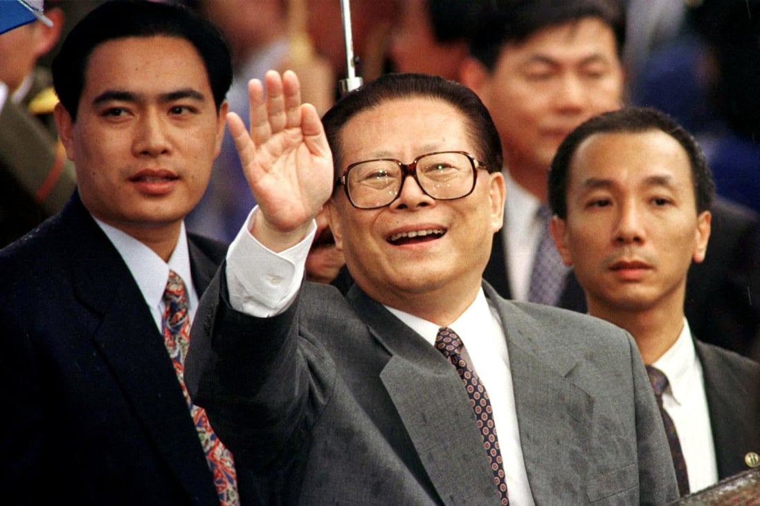 Then president Jiang Zemin smiles through the rain, and waves to a crowd on his arrival in Hong Kong on June 30, 1997. Photo: Reuters