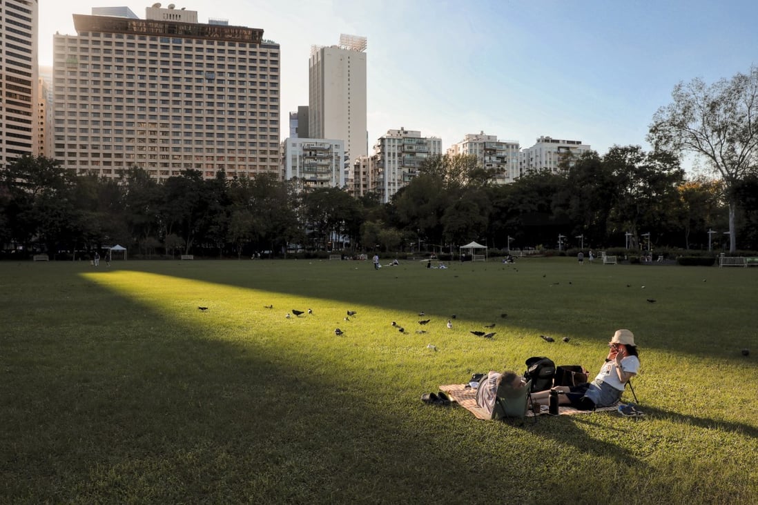 Residents enjoy the sunshine while sitting in Victoria Park in November. Photo: Elson Li