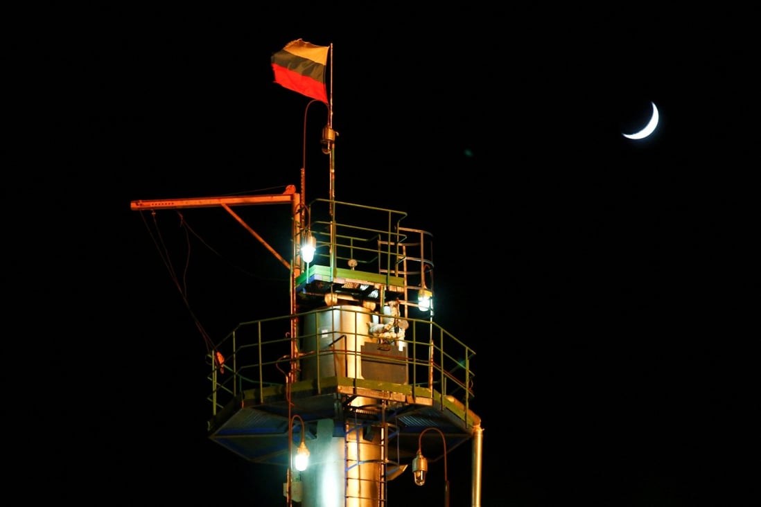 A Russian flag flies on the top of a diesel plant in the Yarakta Oil Field in Russia’s Irkutsk Region in March 2019. Photo: Reuters