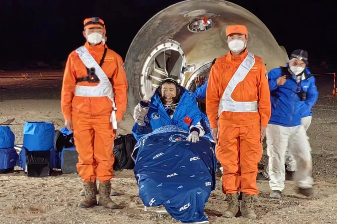 Astronaut Chen Dong celebrates after touching down with the Shenzhou-14 crew in Inner Mongolia on Sunday night. Photo: Xinhua
