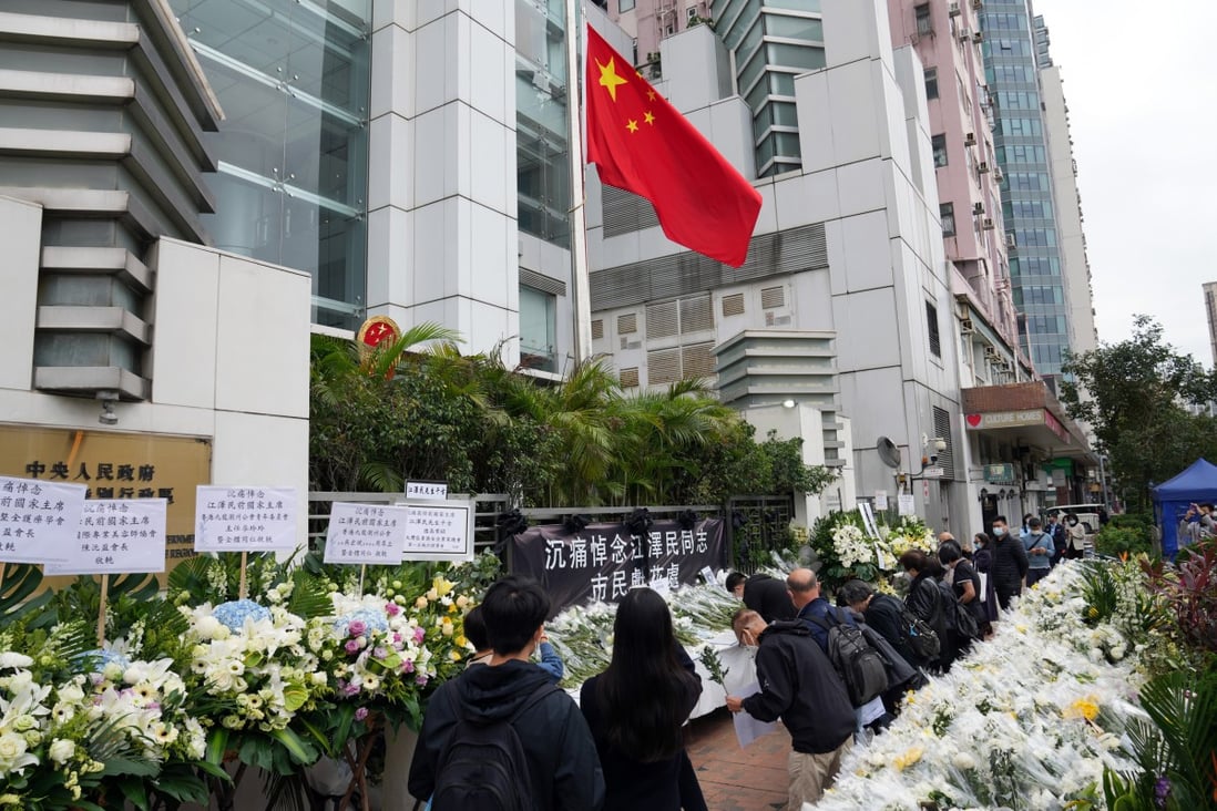 People pay their respects to the late leader Jiang Zemin outside the central government’s liaison office at Sai Ying Pun. Photo: Sam Tsang