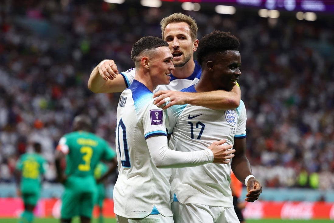 Bukayo Saka celebrates scoring England’s third goal with Harry Kane and Phil Foden at the Fifa World Cup in Qatar on Sunday. Photo: Reuters 