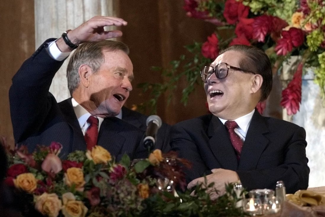 During a trip to the United States in 2002, former Chinese leader Jiang Zemin shares a laugh with his US counterpart, George W. Bush, as they discuss NBA player Yao Ming. Photo: AP