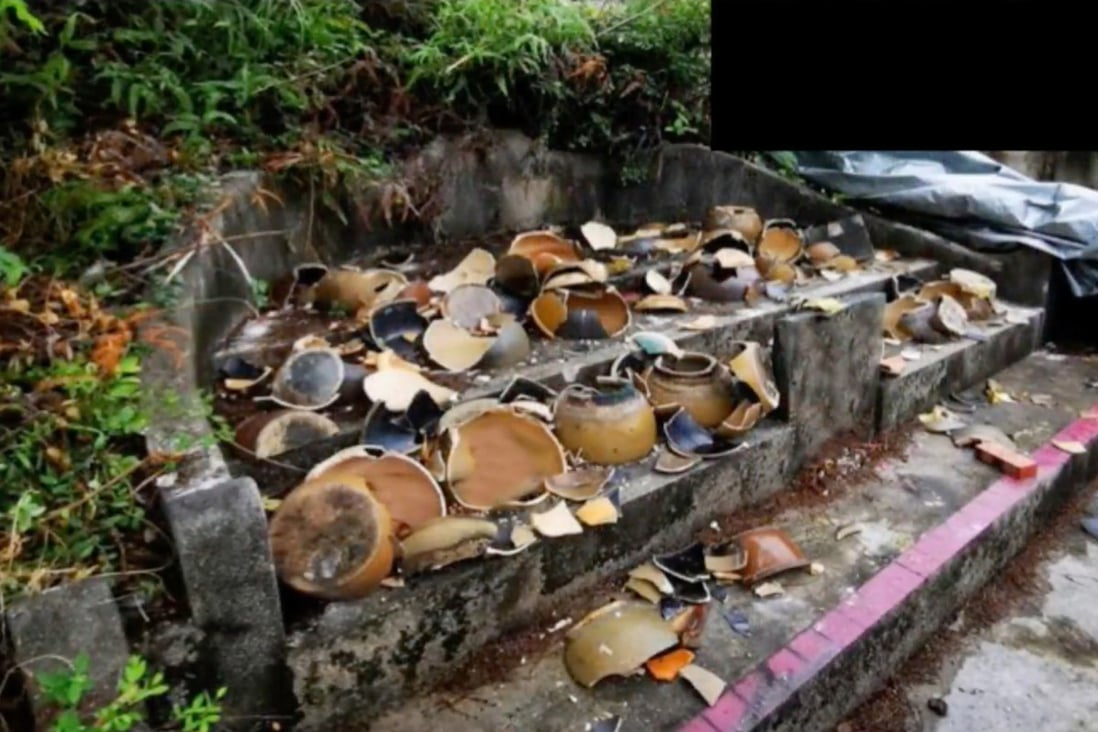 About 160 urns were vandalised near a Tin Shui Wai village in November. Hong Kong police have arrested a suspect. Photo: Hong Kong Police