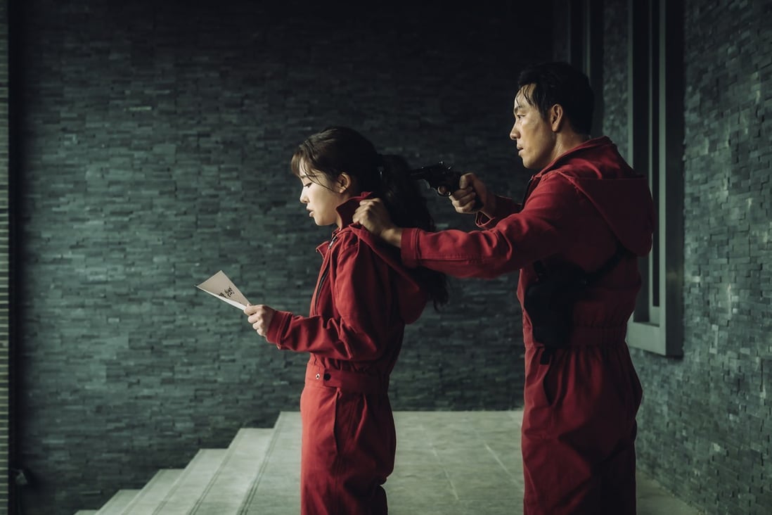 Lee Si-woo as Anne Kim (left) and Park Hae-soo as Berlin in a still from Money Heist: Korea – Joint Economic Area Part 2. Photo: Jung Jaegu/Netflix