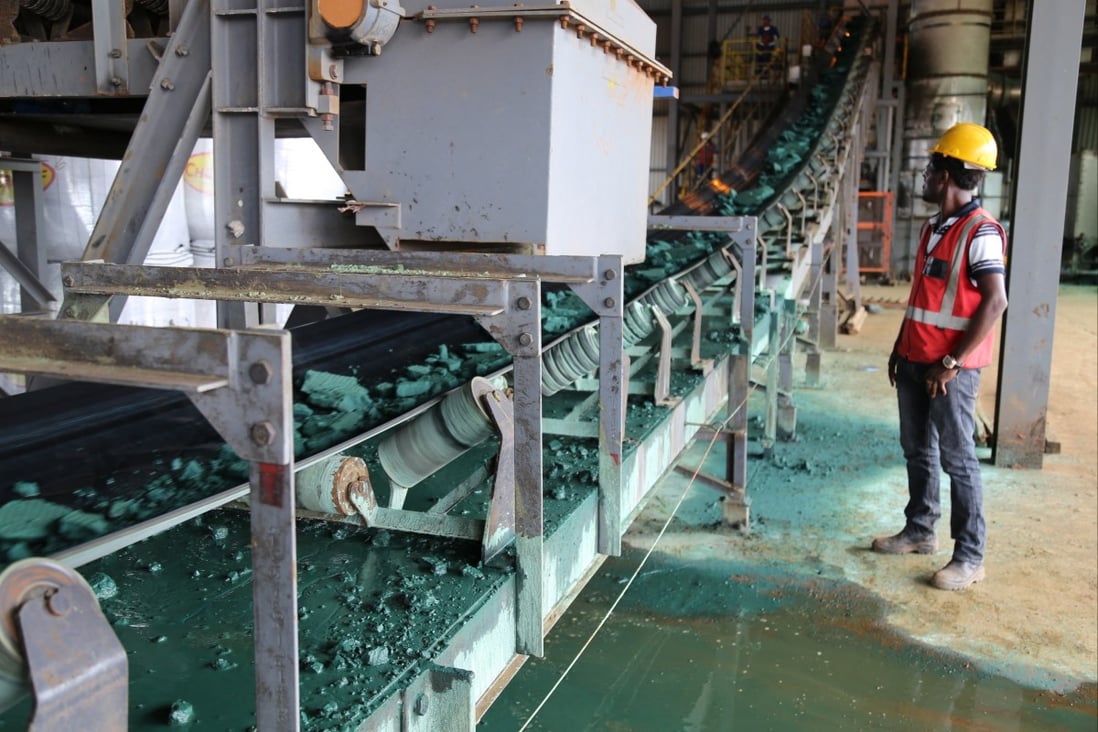 Raw cobalt travels on a conveyor belt at a plant in Lubumbashi, Democratic Republic of Congo. Chinese mine managers are able to closely oversee operations and collect real-time data using a range of hi-tech innovations, including AI, smart sensors and high-speed communication. Photo: AFP