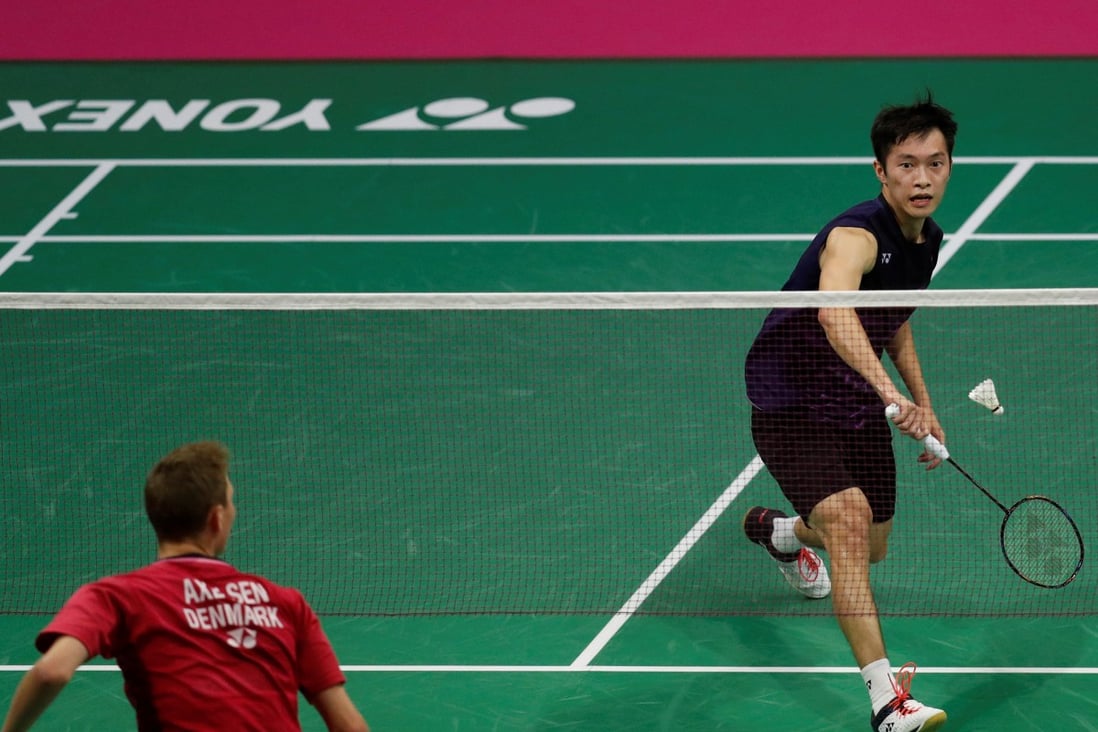 Hong Kong’s Angus Ng Ka-long plays against Viktor Axelsen, whose training camp he has now spent time in. Photo: Reuters