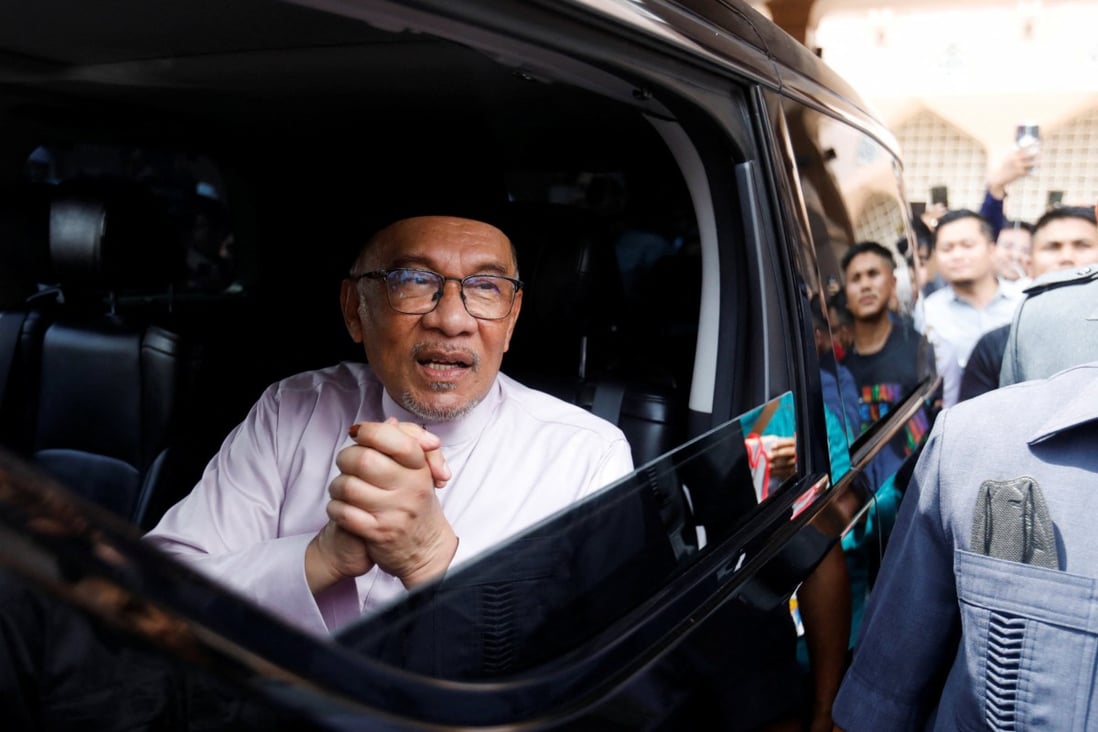 Malaysia’s Prime Minister Anwar Ibrahim meets supporters during his first public appearance. Photo: Reuters