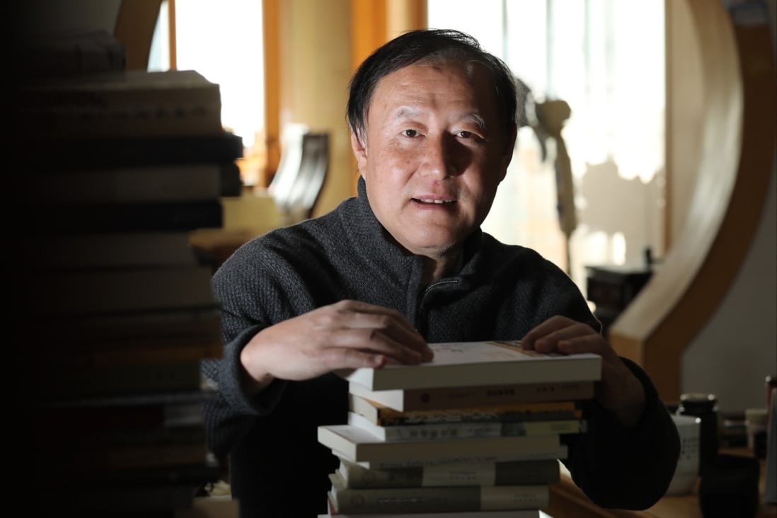 Chinese writer Qi Yimin has penned more than 40 books since getting the idea for his first from working in the “surreal” multinational office of a trading company in Montreal, Canada. Photo: Simon Song