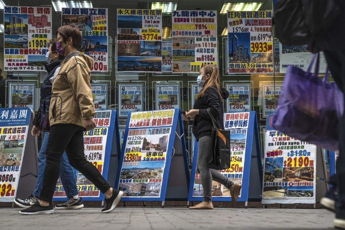 Listings for residential properties for sale at a real estate agency in Hong Kong on December 5, 2022. Photo: Bloomberg.
