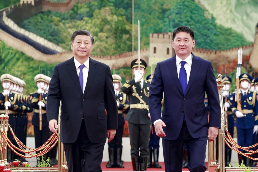 President Xi Jinping (left) walks alongside visiting Mongolian President Ukhnaagiin Khurelsukh before their talks in Beijing last month. Photo: Xinhua