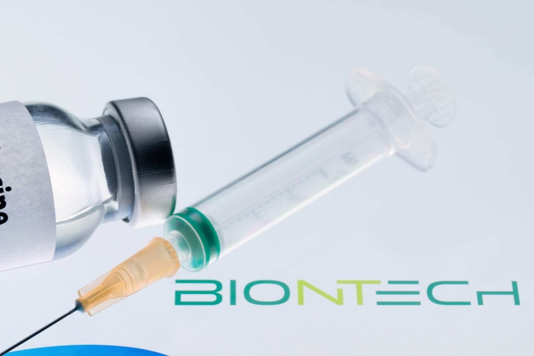(FILES) This file illustration picture taken on November 24, 2020 shows a bottle reading “Vaccine COVID-19” and a syringe next to the Pfizer and BioNtech logos. - Mexico will receive the first vaccines against COVID-19, developed by Pfizer and BioNTech, on December 23, 2020, Mexican Foreign Minister Marcelo Ebrard announced on December 22. (Photo by JOEL SAGET / AFP)