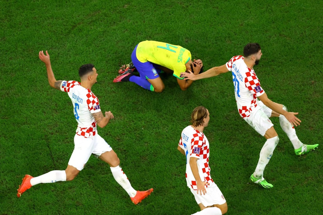 Croatia’s Dejan Lovren, Josko Gvardiol and Lovro Majer celebrate after winning the penalty shootout and qualifying for the semi final as Brazil’s Marquinhos looks dejected. Photo: Reuters