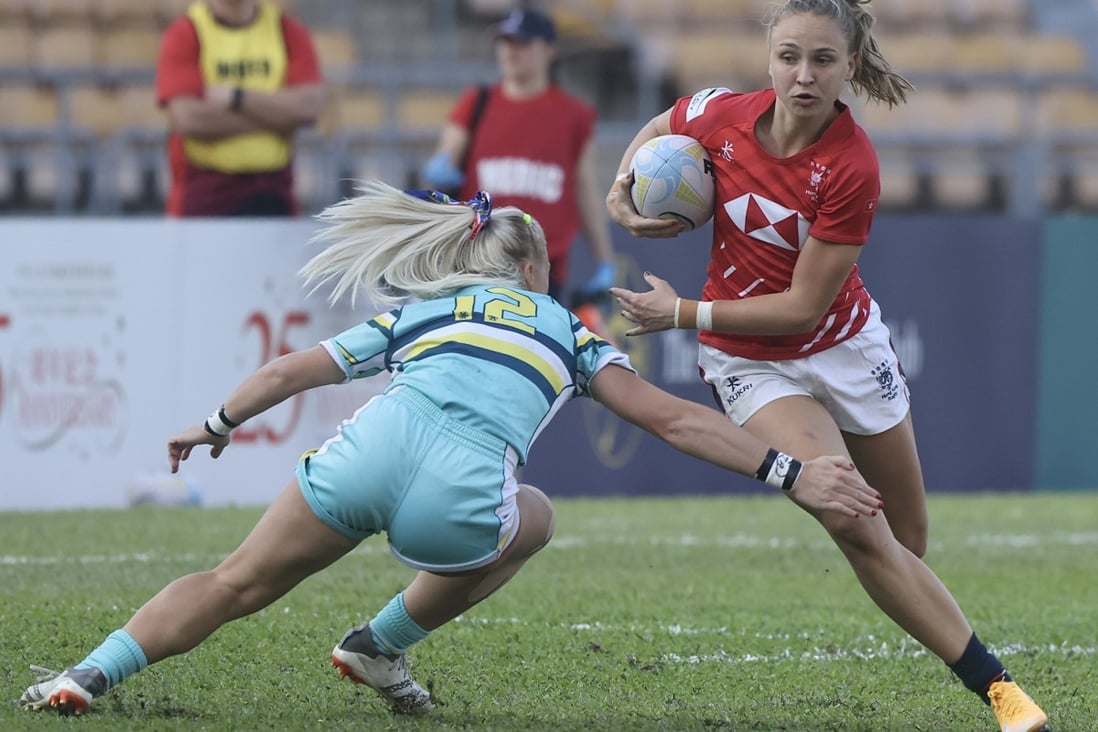 Hong Kong’s Jessica Eden (in red) evades a tackler in the first test at Siu Sai Wan. Photo: Jonathan Wong