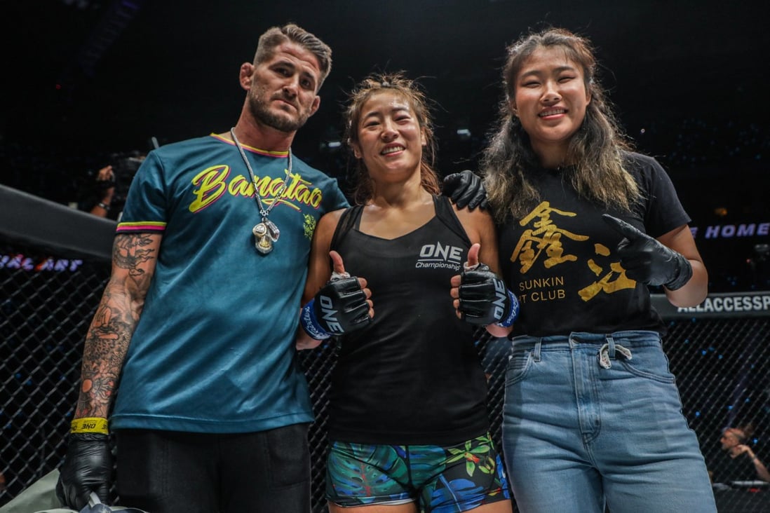 Meng Bo (centre) celebrates with her coach George Hickman (left) and teammate Wu Yanan. Photo: ONE Championship