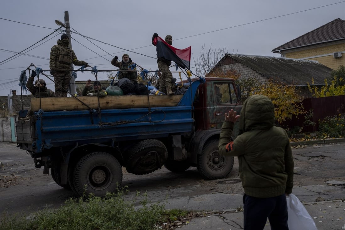 A resident waves to Ukrainian security forces in the Kherson area, southern Ukraine. Photo: AP/File
