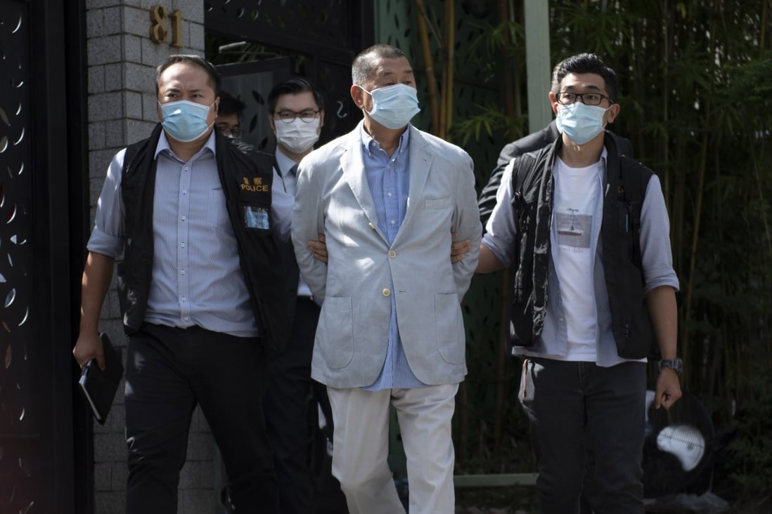 Jimmy Lai (C), founder of Apple Daily, is arrested at his home in Hong Kong, in August 2020. Photo: EPA-EFE