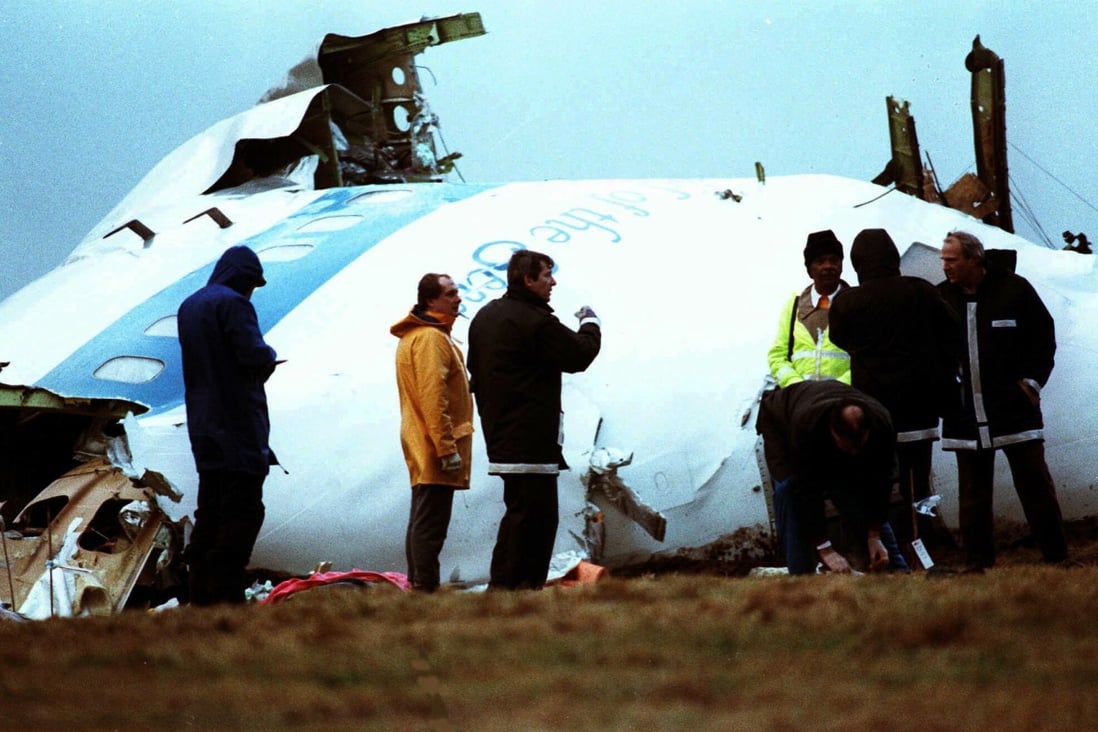 Crash investigators inspect the nose section of the crashed Pan Am flight 103 in a field near Lockerbie, Scotland in1988. Photo: AP