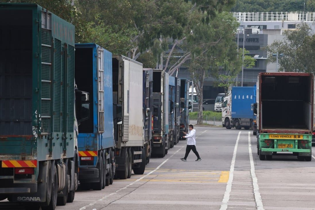 Cross-border trucks queue up at the Man Kam To checkpoint on Monday. Photo: K. Y. Cheng