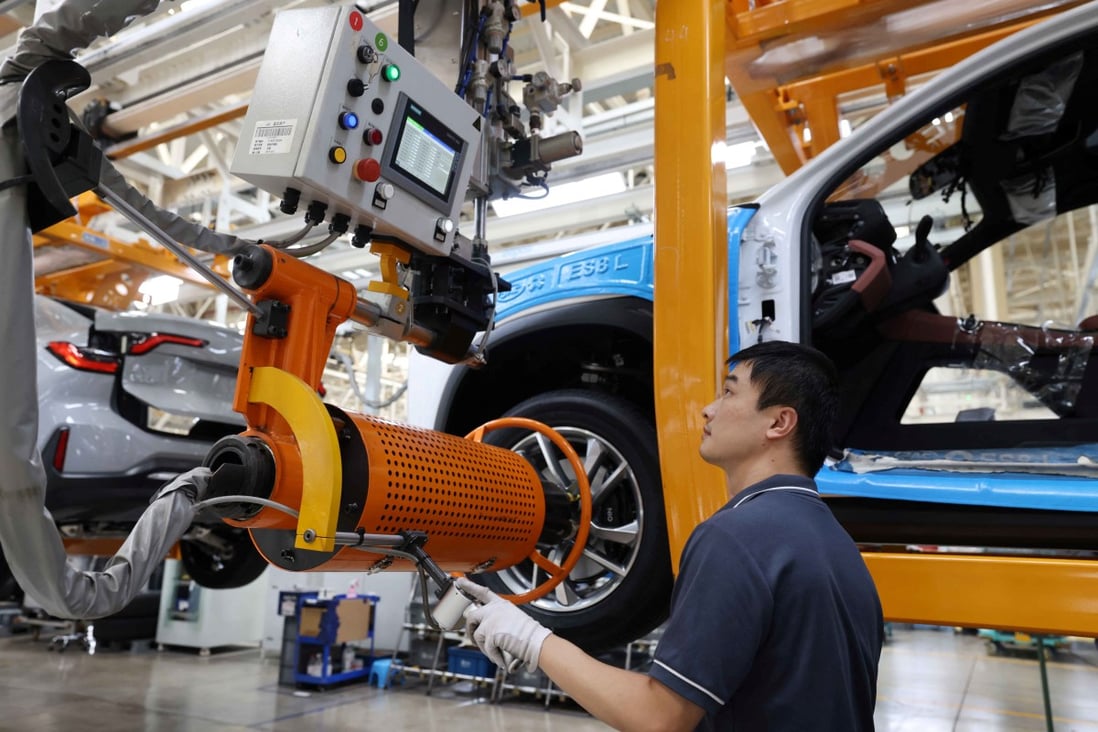 An employee works on the production line of Nio electric vehicles at the JAC-NIO plant in Hefei, Anhui province. Photo: China Daily via Reuters