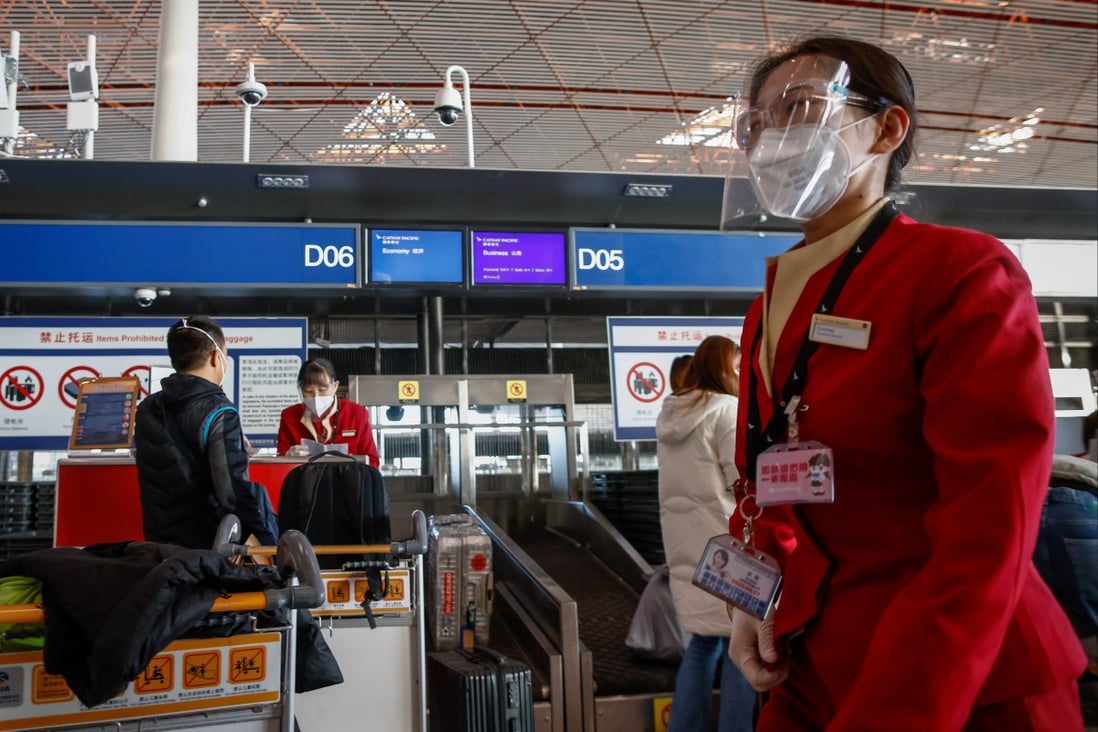 Airline personnel at Beijing Capital International Airport are handling a surge in flights and passengers after the central government eased up on its zero-Covid restrictions. Photo: EPA-EFE