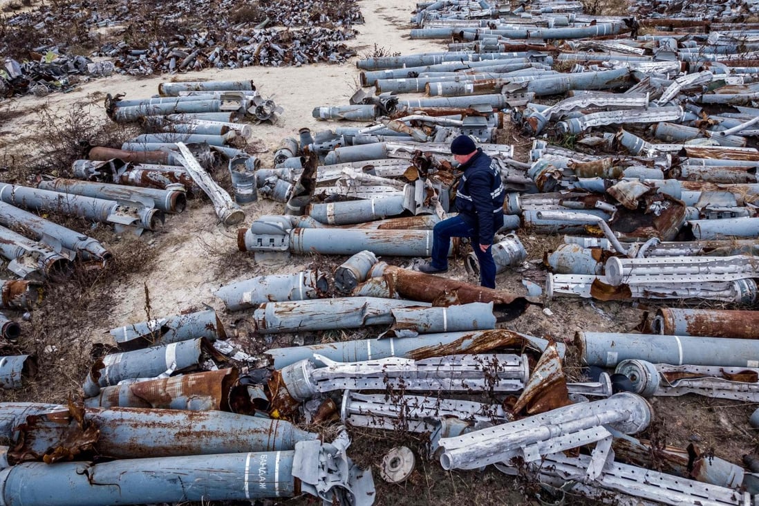 An expert from the prosecutor’s office examines collected remnants of shells and missiles used by the Russian army to attack the Ukrainian city of Kharkiv. Photo: AFP