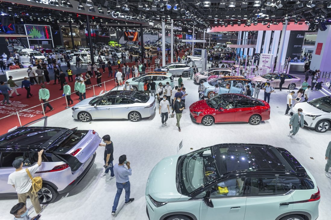 People visit GAC Group’s booth during the 19th Guangzhou International Automobile Exhibition at the China Import and Export Fair Complex on November 20, 2021. Photo: Getty Images