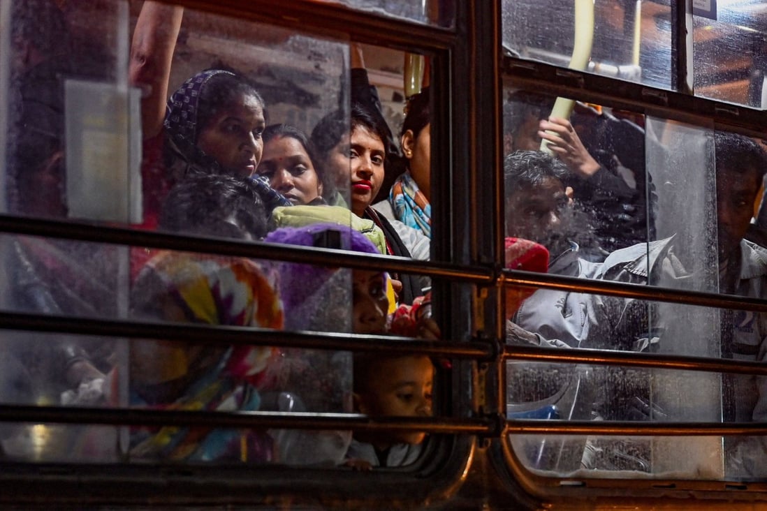 In this photograph taken on December 13, 2022, female commuters travel in a Delhi Transport Corporation bus in New Delhi. Photo: AFP