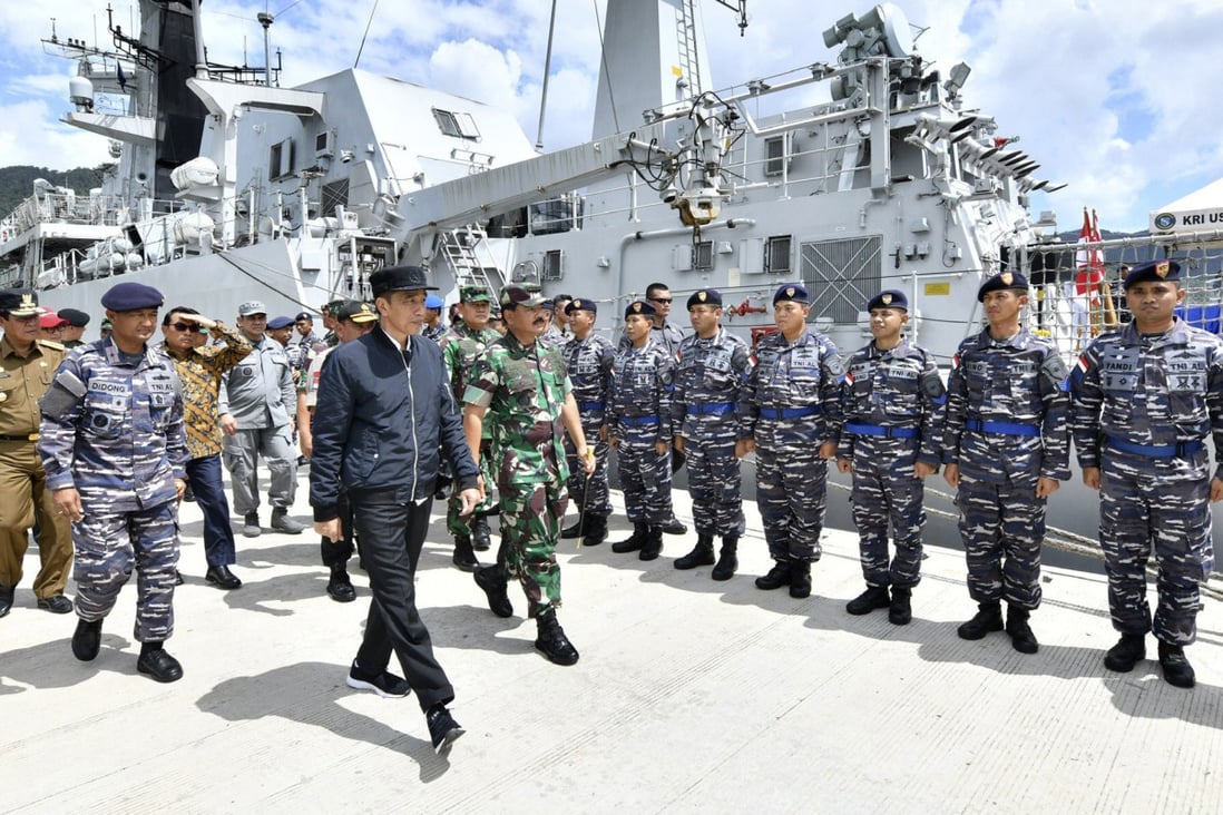 Indonesian President Joko Widodo (centre) inspects troops during his visit to a military base in the Natuna Islands. File photo: Indonesian Presidential Office via AP