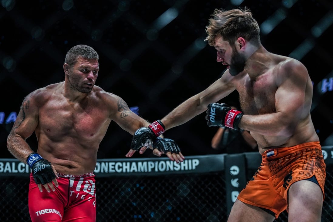 Reinier de Ridder (right) looks to fend off Anatoly Malykhin. Photos: ONE Championship