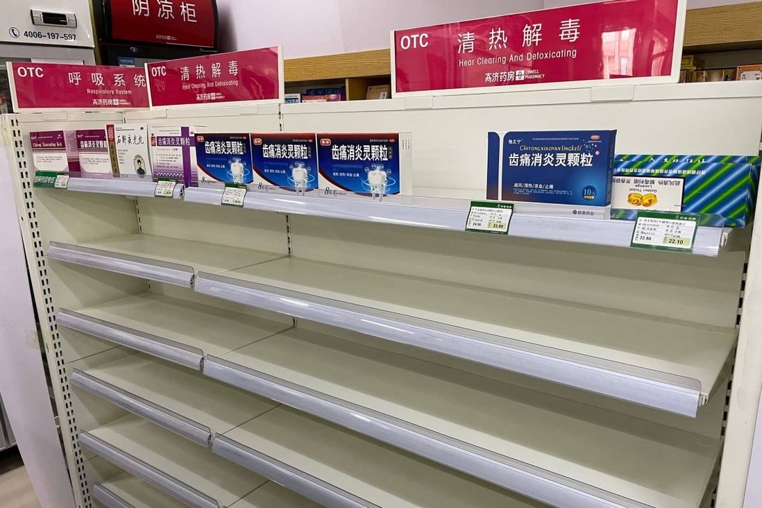 An almost empty shelf of cold medicines at a pharmacy in Beijing. Photo: AFP