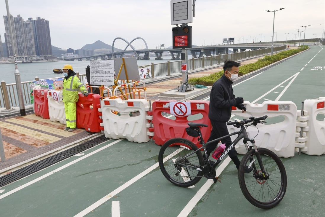 A cyclist at the closed pathway to the Cross Bay Link in Tseung Kwan O. Photo: Dickson Lee