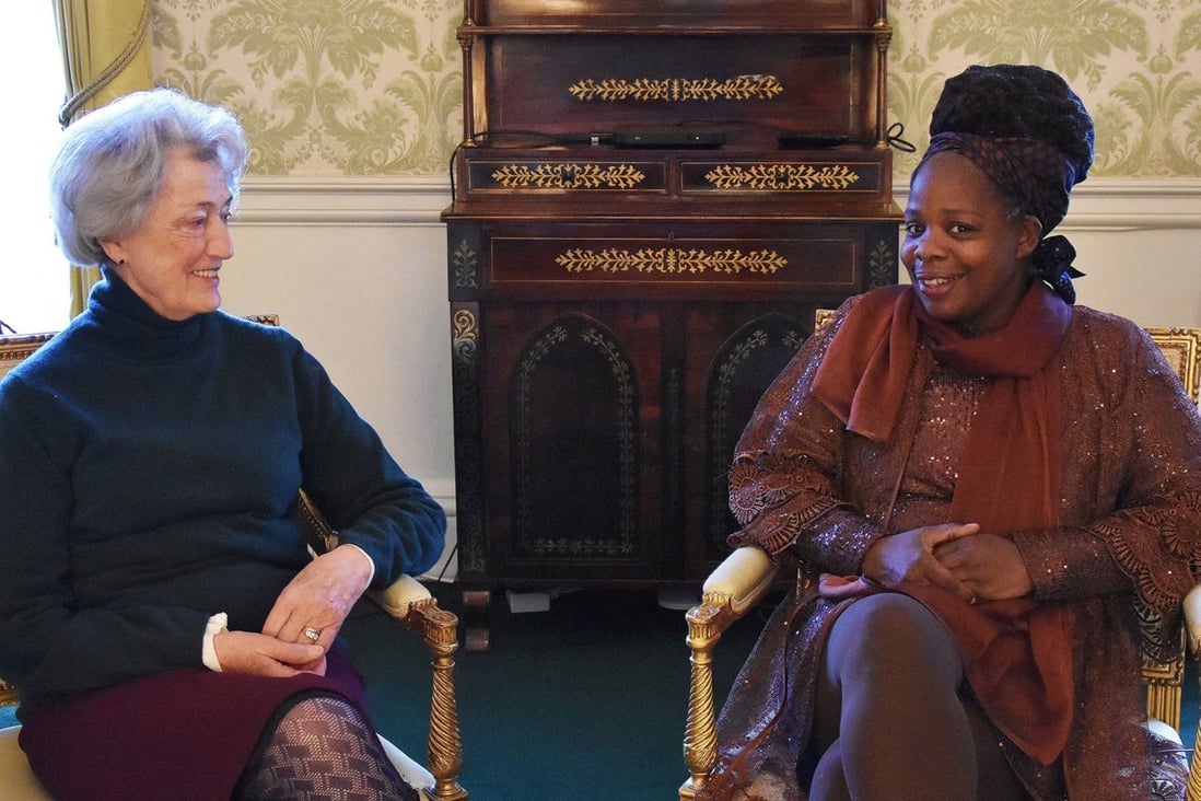 Lady Susan Hussey meets Ngozi Fulani, founder of the charity Sistah Space, in the Regency room in Buckingham Palace on Friday. Photo: Royal Communications/PA Wire via Reuters
