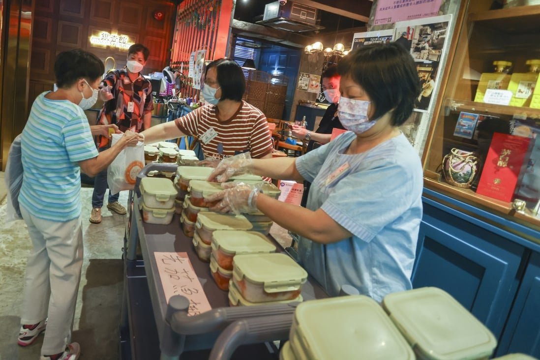 Staff and volunteers distribute meals at the social enterprise Gingko House in Yau Ma Tei on August 1. Gingko House is one of the social enterprises seeking to provide work opportunities for seniors. Photo: Jonathan Wong