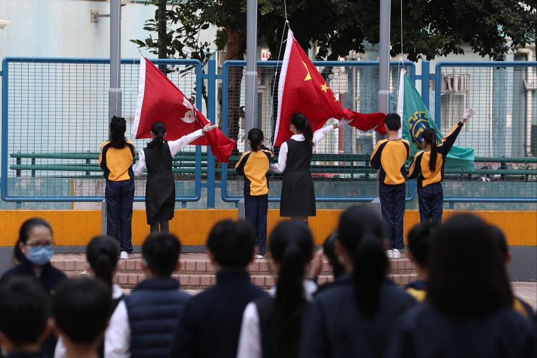 Children take part in a school flag-raising ceremony. Photo: Jonathan Wong