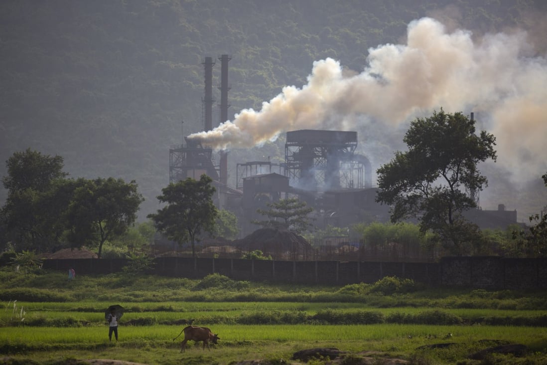 Smoke rises from a coal-powered steel plant at Hehal village in the eastern state of Jharkhand, India in September 2021. Photo: AP
