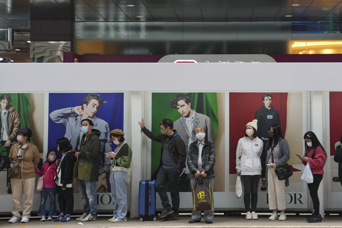 People queue at a tram station in Hong Kong’s Central district on December 13, 2022. Photo: Sam Tsang