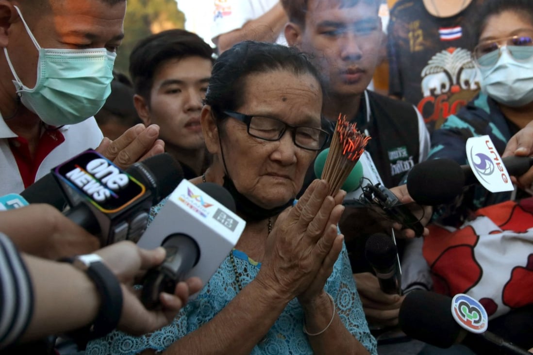 A relative of one of the missing Thai sailors prays as families wait for news on the rescue mission. Photo: Reuters