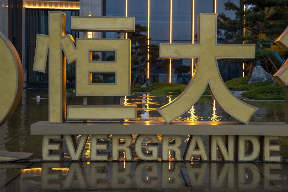 Signage for the China Evergrande Group outside the Royal Peak residential development in Beijing. Photo: Bloomberg
