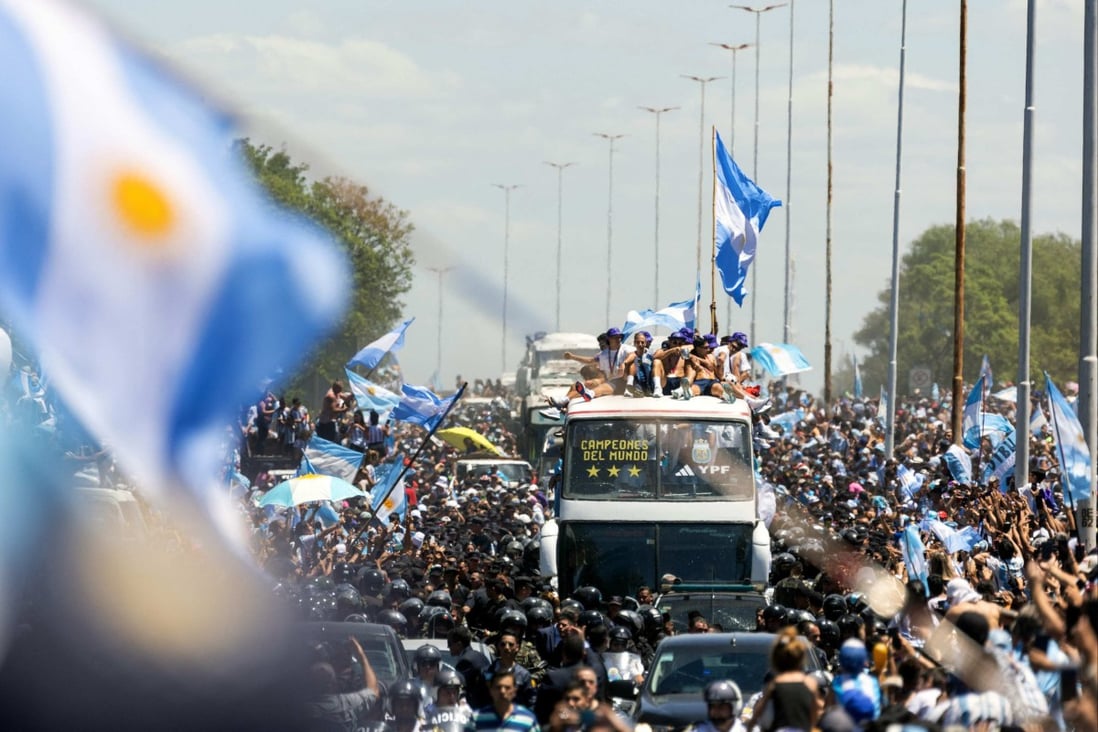 Fans of Argentina bring the open-bus parade to a halt in Buenos Aires. Photo: AFP