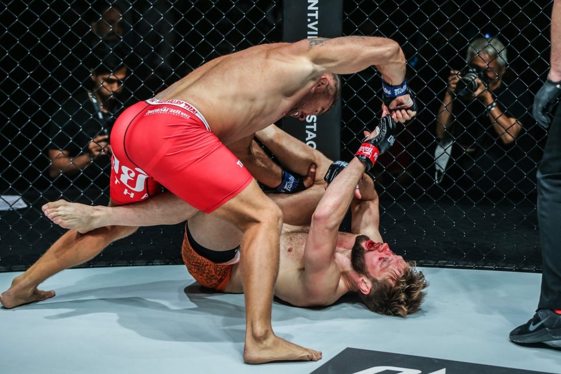 Anatoly Malykhin delivers hammer fists to finish Reinier de Ridder. Photos: ONE Championship