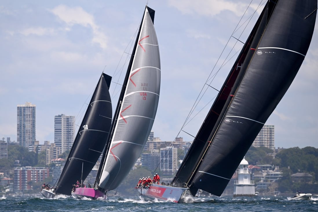 Wild Oats (right) leads Stefan Racing and Willow (left) during the 2022 SOLAS Big Boat Challenge on Sydney Harbour. Photo: EPA-EFE