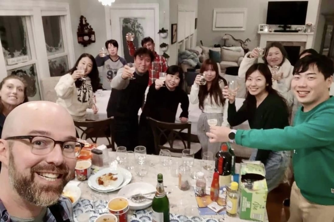 Alex Campagna (left) with the stranded South Korean tourists at his home in New York. Photo: Alex Campagna/Facebook