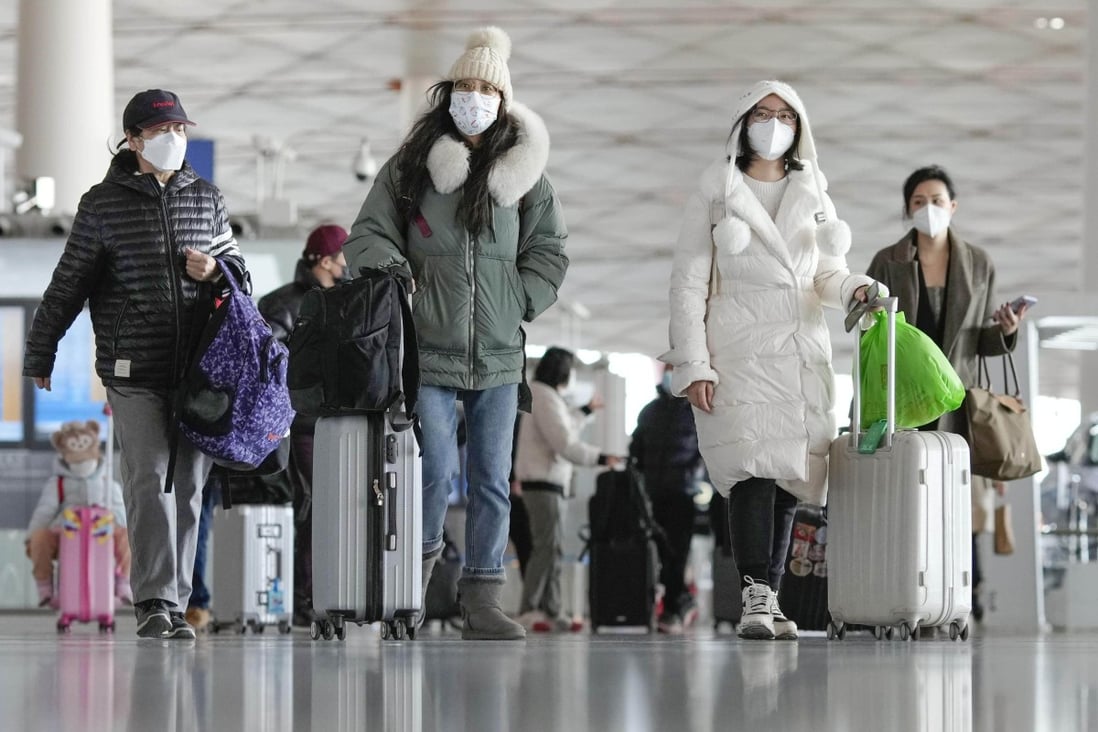 Travellers at a departure lobby at Beijing Capital International Airport on Tuesday. US health officials said that starting on January 5, passengers arriving from China will be required to test negative for Covid-19 tests before being permitted to enter, according to reports. Photo: Kyodo