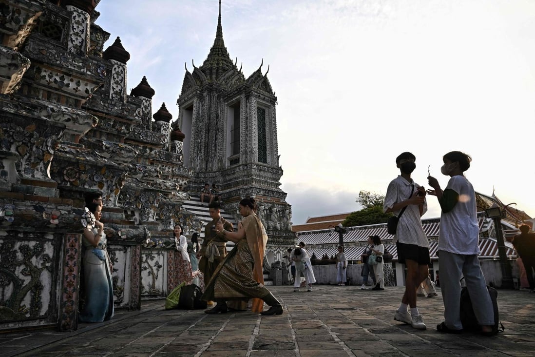 Thailand battles worker crunch as it gears up for influx of Chinese tourists 4 Tourists visit the Wat Arun Buddhist temple in Bangkok, Thailand. Photo: AFP