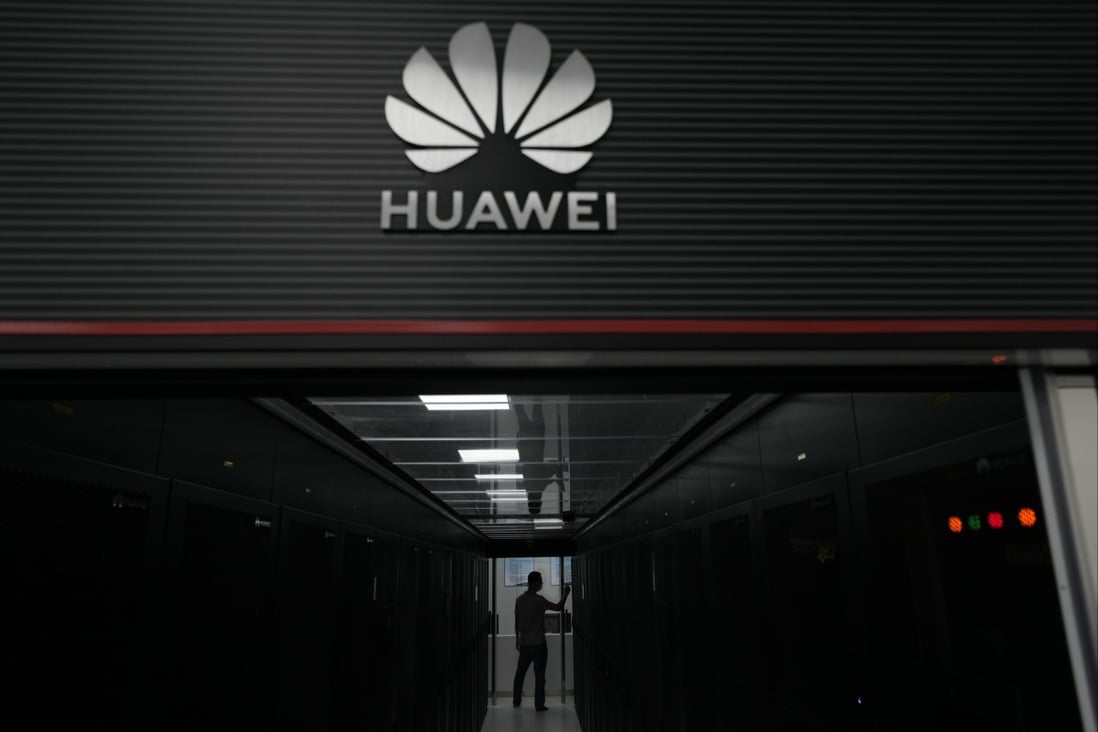 A technician at the entrance to a Huawei 5G data server centre at Guangdong Second Provincial General Hospital in Guangzhou, China. Photo: AP